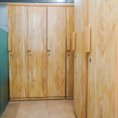 Numbered full-height wardrobes, one per resident, at Zest Stays 1054
